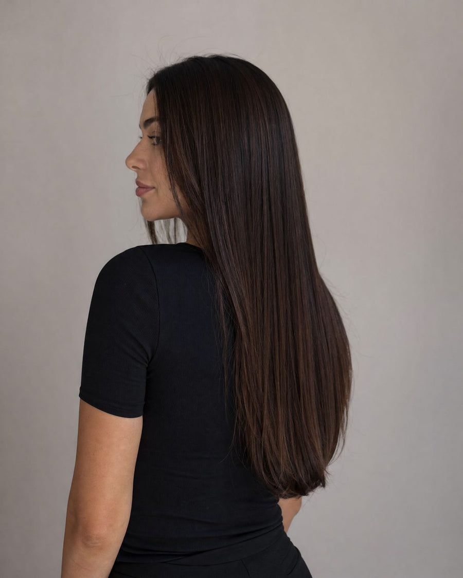 Sleek frizz-free dark brown hair