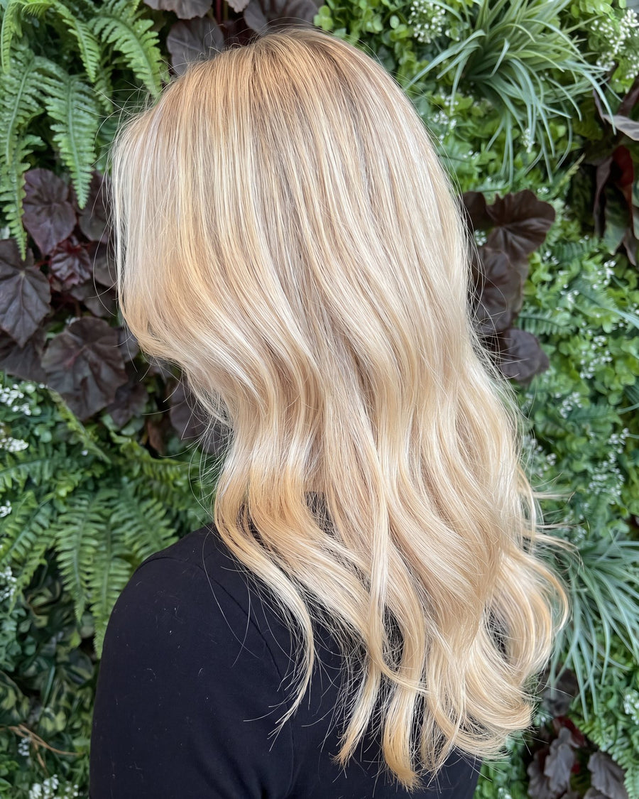 Bright toned blonde on long layered hair