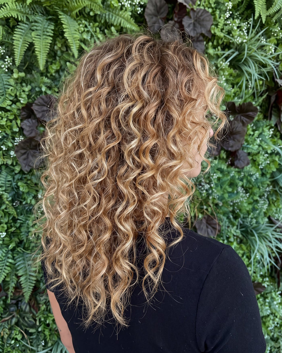 Defined blonde ringlets after a curl cut