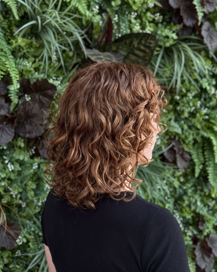 Copper curls in a shaped curly bob